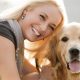 Happy And Cheerful Woman With Her Dog.