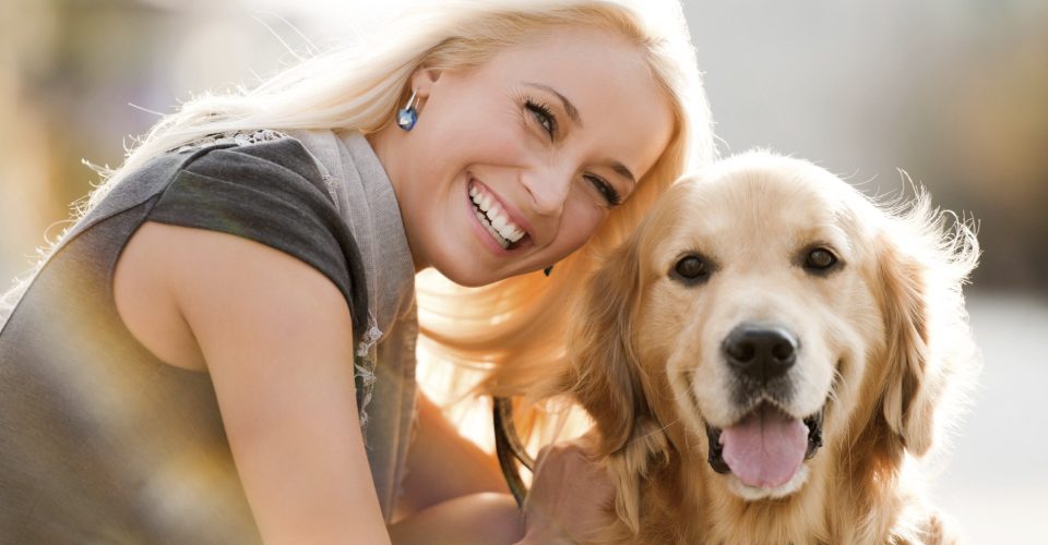 Happy And Cheerful Woman With Her Dog.